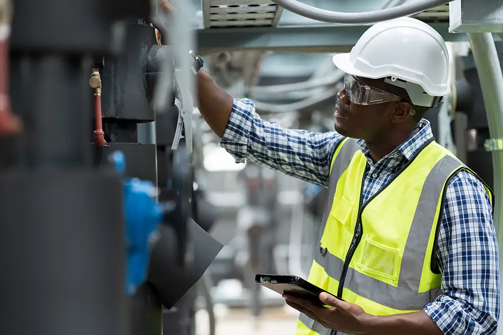 Engineer inspecting plumbing